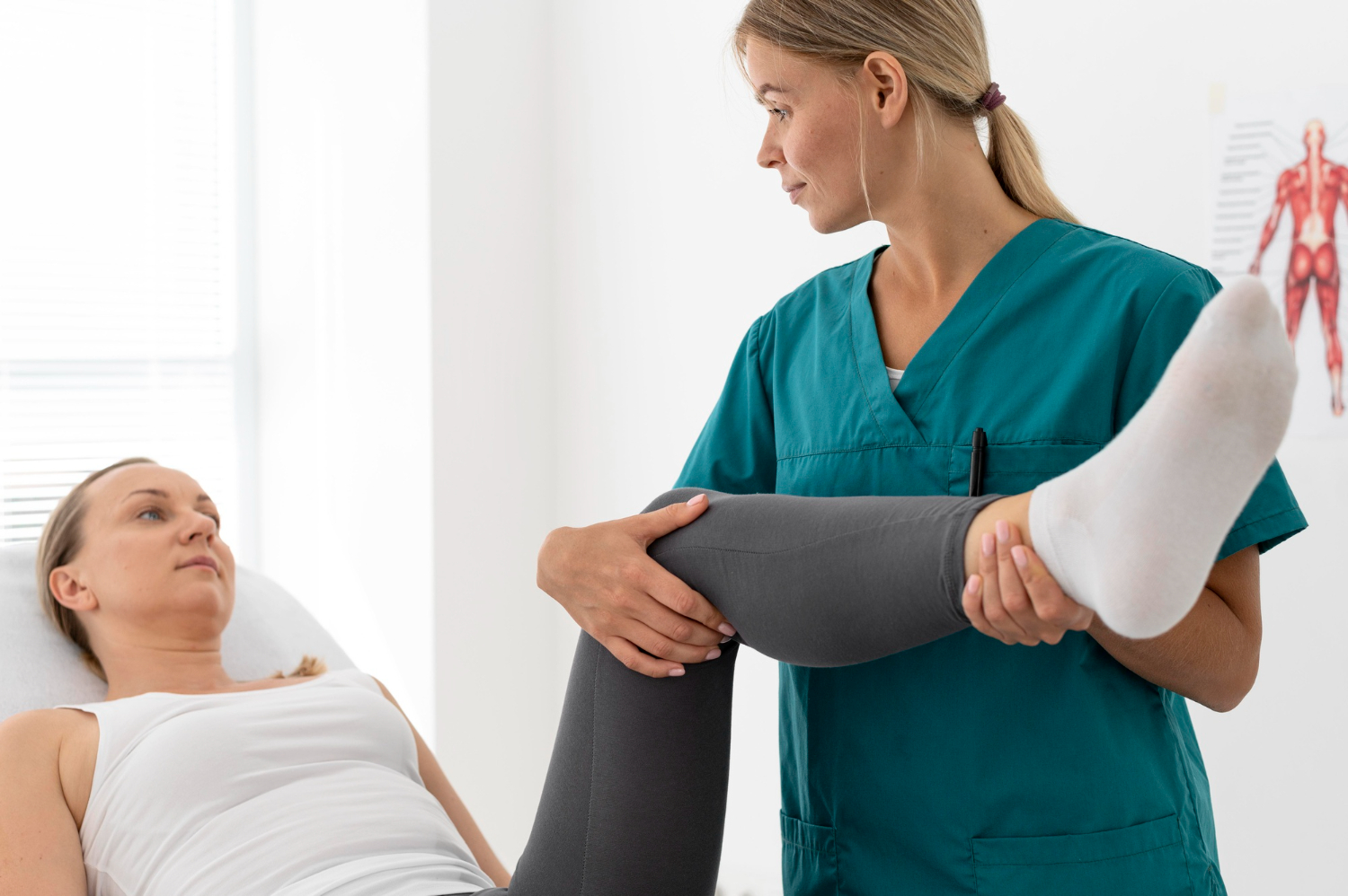 physiotherapist checking woman's leg flexibility
